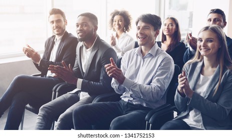 Business audience applauding to speaker at conference, listening leader - Powered by Shutterstock