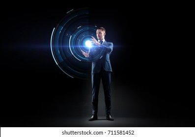 Business, Augmented Reality, People And Future Technology Concept - Businessman In Suit Working With Virtual Projection Over Black Background