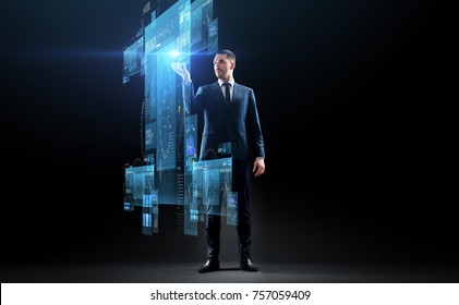 Business, Augmented Reality, People And Future Technology Concept - Businessman In Suit Working With Virtual Screens Projection Over Black Background