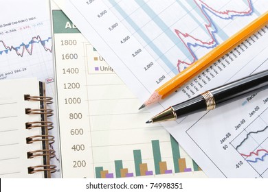 Business background, financial data concept with pen - Shutterstock ID 74998351