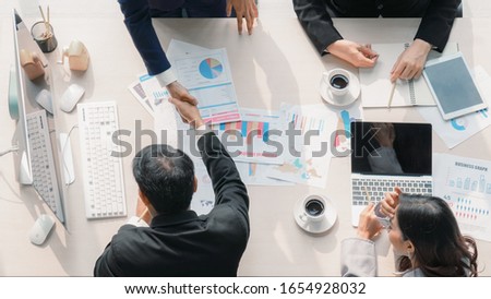 business background of two businessmen having handshake together after geting business deal in meeting at office