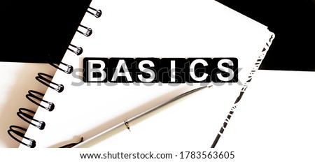 Business BASICS on notepad. Work business tex RISK