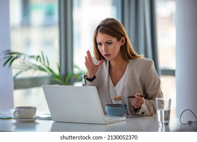 Business Beautiful Happy Woman Working From Home While Having Breakfast With Laptop On The Table. She Is Focused On Work And Does Not Want To Take A Break. Eat At Home.