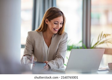 Business Beautiful Happy Woman Working From Home While Having Breakfast With Laptop On The Table. She Is Focused On Work And Does Not Want To Take A Break. Eat At Home.