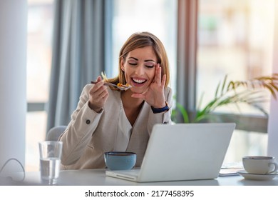 Business Beautiful Happy Woman Working From Home While Having Breakfast With Laptop On The Table. She Is Focused On Work And Does Not Want To Take A Break. Eat At Home.