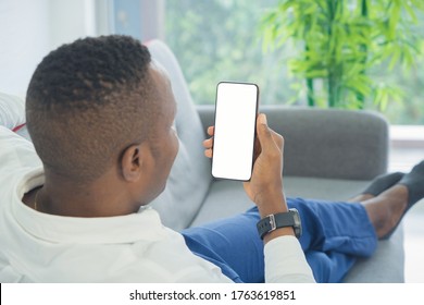 Business Black American Man, African Person Using A Smartphone Or Mobile Phone With Blank Screen Space On Webcam Video Call Conference Or Using Application In Quarantine In Corona Virus Concept.