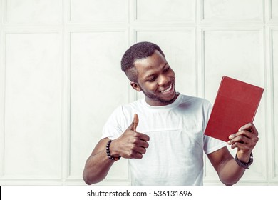 Business Black Man Holding A Book