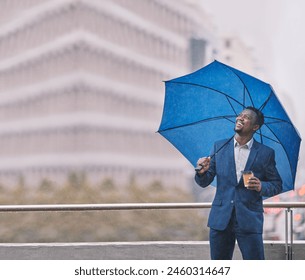 Business, black man and smile with umbrella in city for rain, winter season and weather with coffee. African male person, urban town and protection with ideas for life cover and insurance or policy - Powered by Shutterstock