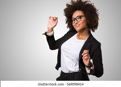 Business Black Woman Dancing On A Grey Background