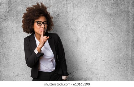 business black woman doing silence gesture