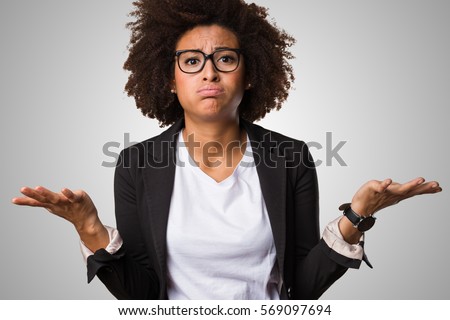business black woman doubting on a grey background
