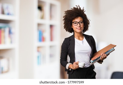 Business Black Woman Holding A Cup Of Coffee And Files