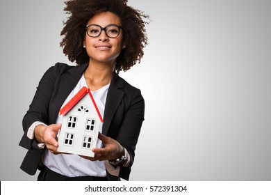 Business Black Woman Holding A Small House