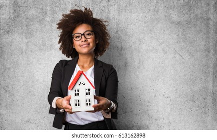 Business Black Woman Holding A Small House