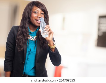 business black woman holding a water bottle