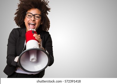 business black woman shouting on the megaphone - Shutterstock ID 572391418