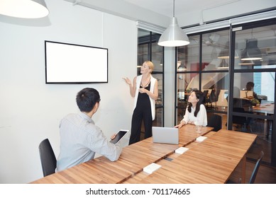 Business Blonde Woman Presenting A Project On Blank Screen TV