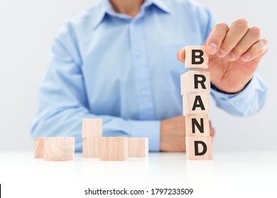 Business Brand Building Or Branding For Company Identity And Marketing Businessman Stacking Wood Cube Blocks With Letters