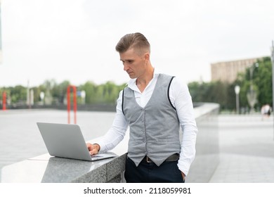 Business. Businessman Using Laptop Outdoors. Serious Pensive Caucasian Male Business Person Computer Outside Modern Technology Concept Young Adult Manager Crisis Thinking Trouble Idea 