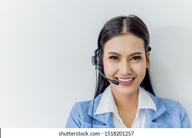 Business Call Center Customer Support - Beautiful Asian Female Staff Operator Wearing Headphone With Microphone On White Background. 