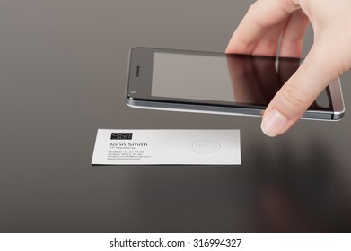 Business Card With Embedded NFC Tag And A Phone