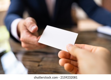 Business Card Exchange. Holding Visiting Or Reference Card