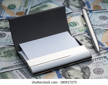 Business Card Holder And Pen On The Background Of The New Hundred Dollars American