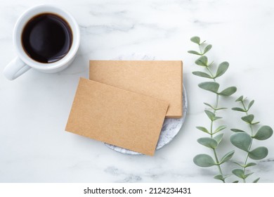 Business Card Kraft Paper Mockup On Marble Table With Coffee Cup And Plant, Flatlay