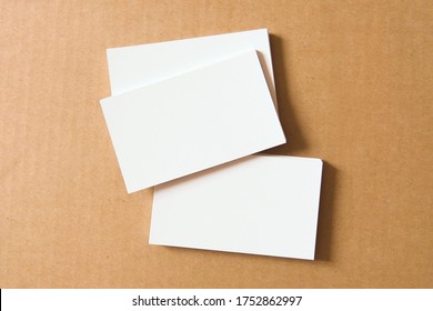 Business card on colored background. Blank name card for company logo,  Branding Mock-up. Flat lay. Copy space for text                                - Shutterstock ID 1752862997