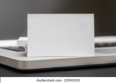 Business Card Stadning Up On Computer