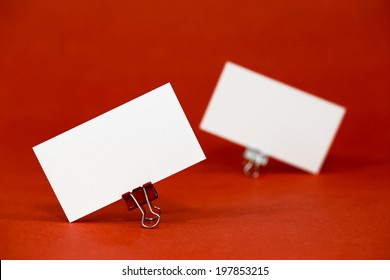 Business Card Template Mockup For Branding Identity And Hipster Logo Prints. Isolated On Red Paper Background.