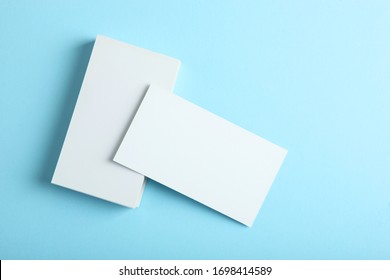 business cards on a colored background top view. Place to insert text
