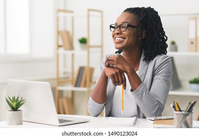 Business Career Concept. Afro Businesswoman Smiling Sitting In Modern Office. Copy Space