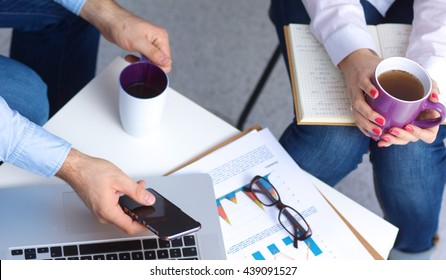 Business Casual Conversation Over A Cup Of Coffee