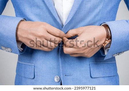 Business casual style of man, closeup. Male menswear for man in formalwear. Business suit concept. Menswear for man wearing jacket. Man in suit jacket unbutton with hands. Looking luxury [[stock_photo]] © 