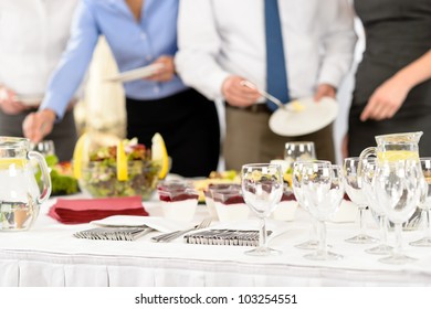 Business Catering People Serving Themselves Buffet At Company Meeting