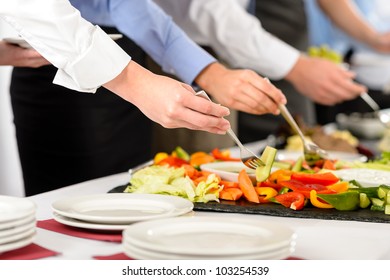 Business catering people take buffet food during company event - Powered by Shutterstock