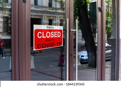 Business Center Closed Due To COVID-19, Sign With Sorry In Door Window. Stores, Restaurants, Offices, Other Public Places Temporarily Closed During Coronavirus Pandemic. Economy Hit By Corona Virus