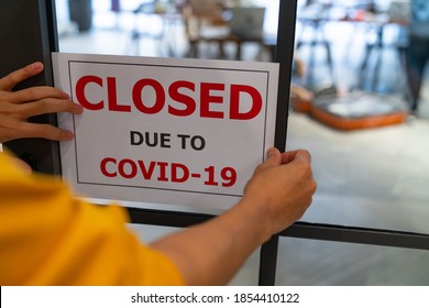 Business Center Closed Due To COVID-19, Sign With Sorry In Door Window. Stores, Restaurants, Offices, Other Public Places Temporarily Closed During Coronavirus Pandemic. Economy Hit By Corona Virus.