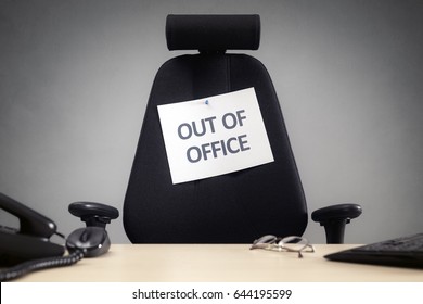 Business Chair With Out Of Office Sign Concept For Vacation, Holiday, Lunch Break Or Work Life Balance