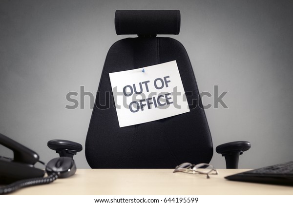 Business chair with out of\
office sign concept for vacation, holiday, lunch break or work life\
balance