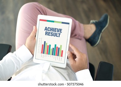 Business Charts and Graphs on screen with ACHIEVE RESULT title
