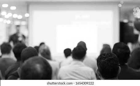 Business Coach. Team Leader Teaches Employees At A Business Meeting In A Conference Room. Speaker Giving A Talk At A Corporate Business Seminar.
Audience In Hall With Presenter In Lecture Photo.
