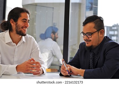 Business coaching session with two males Pacific Islanders and Maori - Shutterstock ID 2216132173
