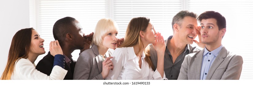 Business Colleague Whispering Secret Gossip To An Man With Wide Open Mouth