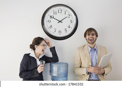 Business Colleagues Conversing At Water Cooler