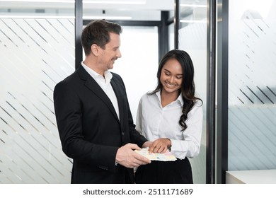 Business colleagues discussing color palette options during a creative meeting in a modern office - Powered by Shutterstock