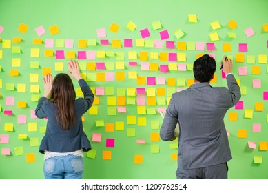 Business colleagues discussing future priorities - Shutterstock ID 1209762514