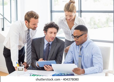 Business Colleagues Discussing Report Office Stock Photo 404378080 ...