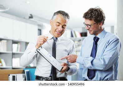 Business colleagues discussing together in an office